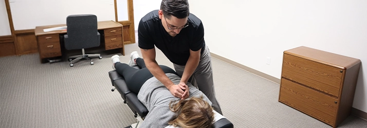 Chiropractor Leavenworth KS Dennis Lindsay Adjusting Patient