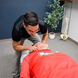 Chiropractor Leavenworth KS Dennis Lindsay Adjusting Athletes Neck